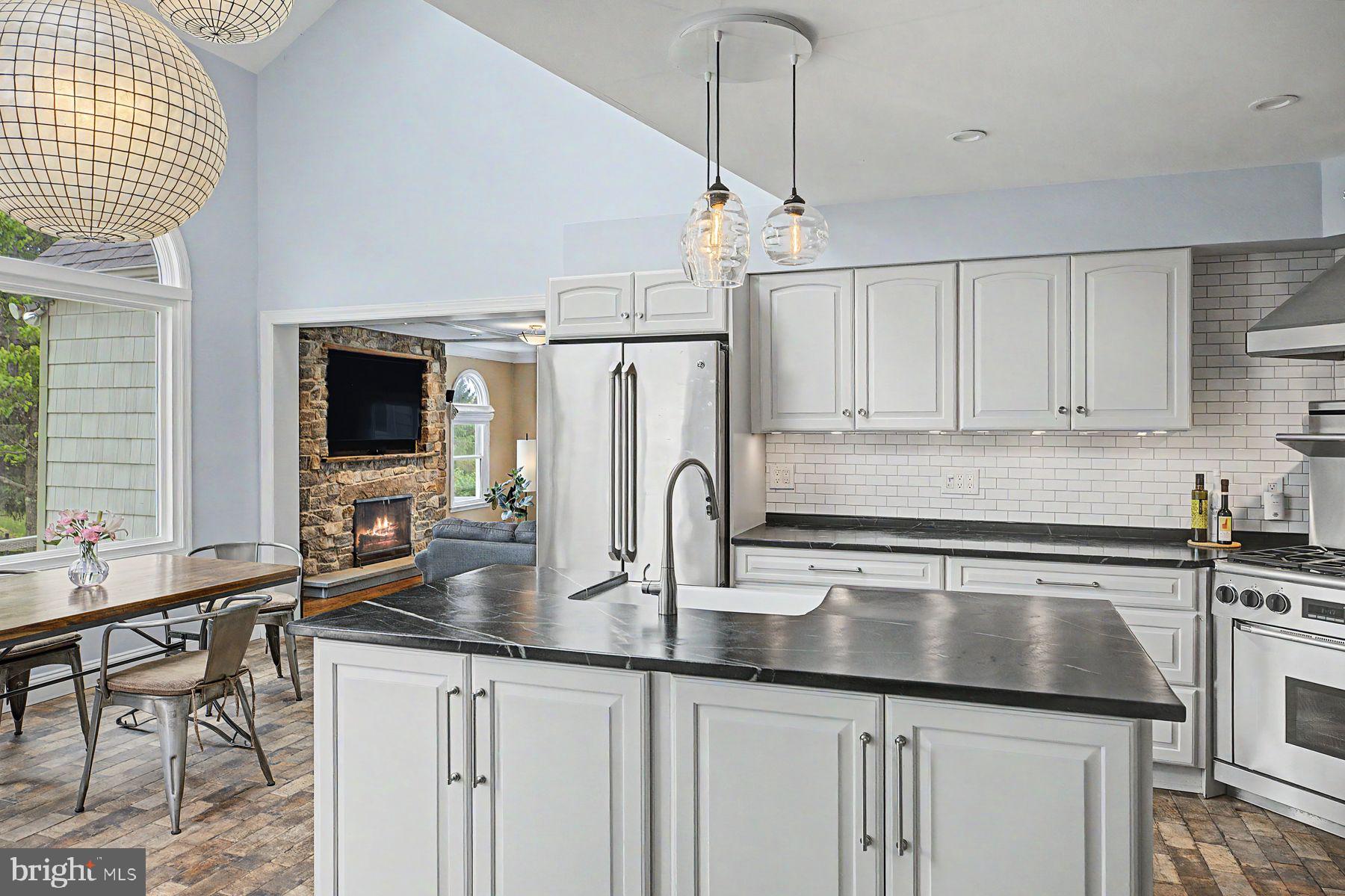 4009 Smoke Road Doylestown, PA 18902 - Photo 8 of 52 a kitchen with granite countertop a sink stainless steel appliances and cabinets
