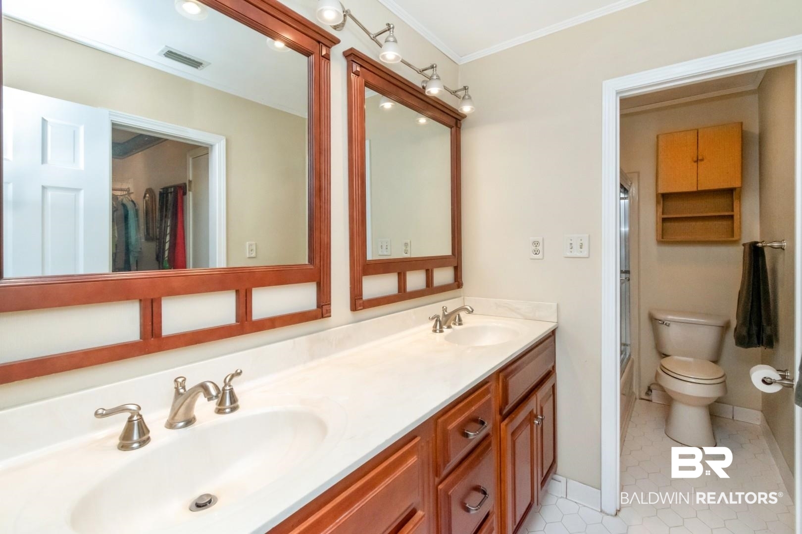 8220 Fordham Road Mobile, AL 36619 - Photo 16 of 41 Bathroom with a sink, crown molding, toilet, and visible vents