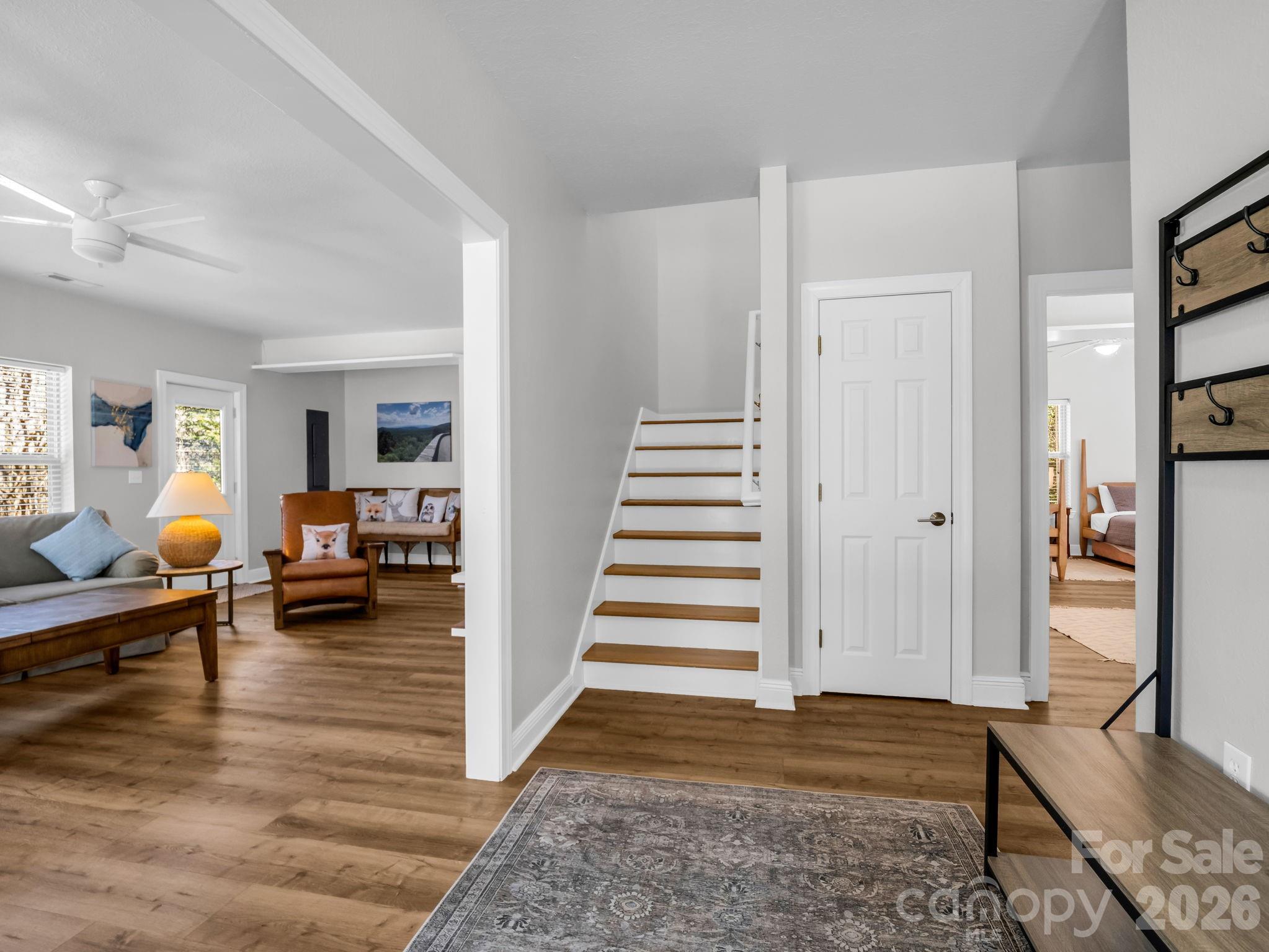 121 Fern Loop Lake Lure, NC 28746 - Photo 12 of 40 a view of a livingroom with wooden floor and furniture