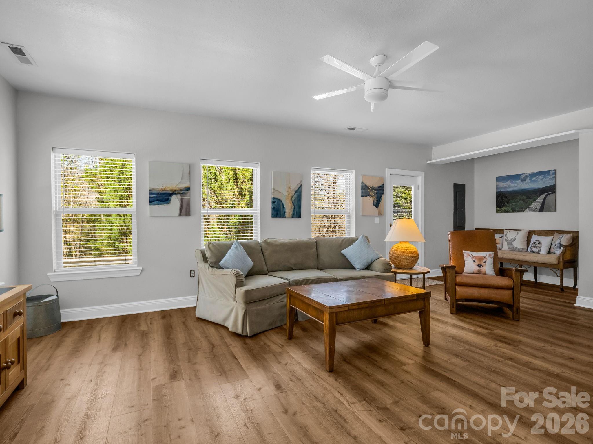 121 Fern Loop Lake Lure, NC 28746 - Photo 13 of 40 a living room with furniture and wooden floor