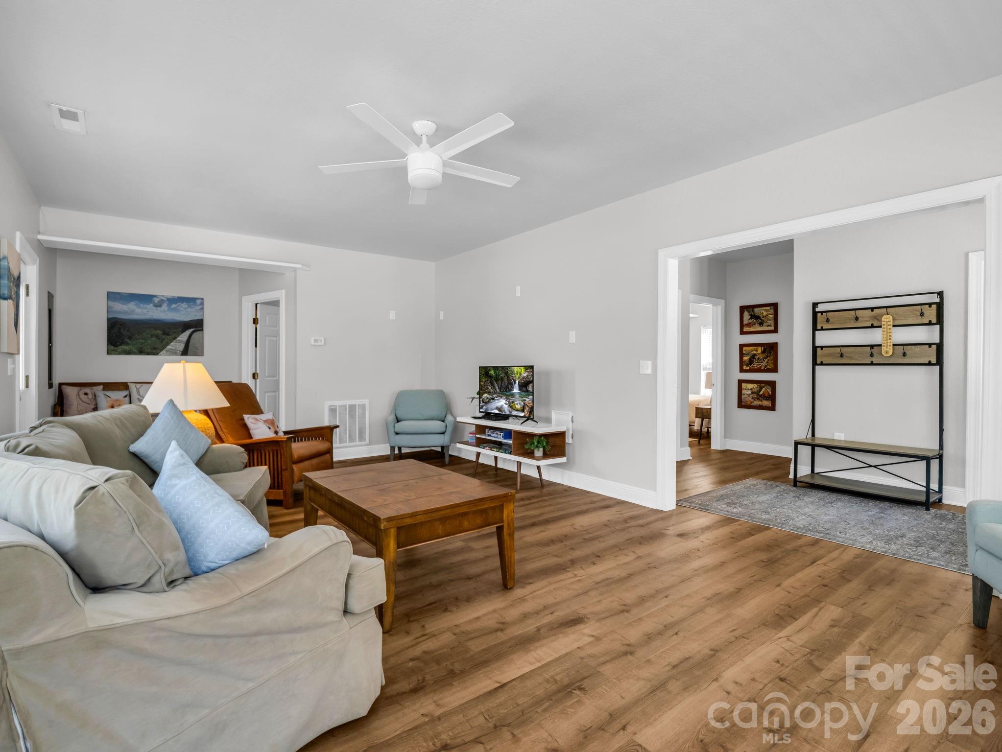 121 Fern Loop Lake Lure, NC 28746 - Photo 14 of 40 a living room with furniture and wooden floor