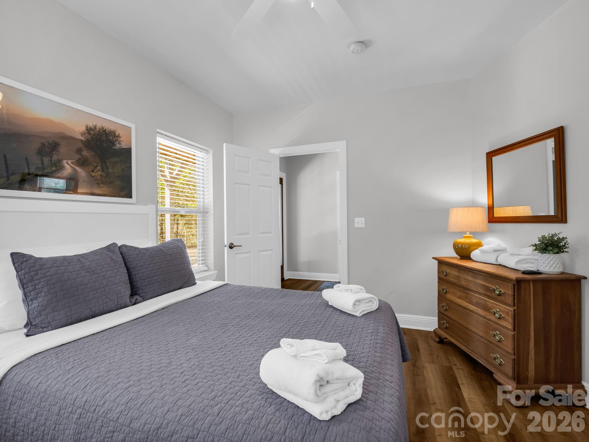 121 Fern Loop Lake Lure, NC 28746 - Photo 15 of 40 a bedroom with a bed and window