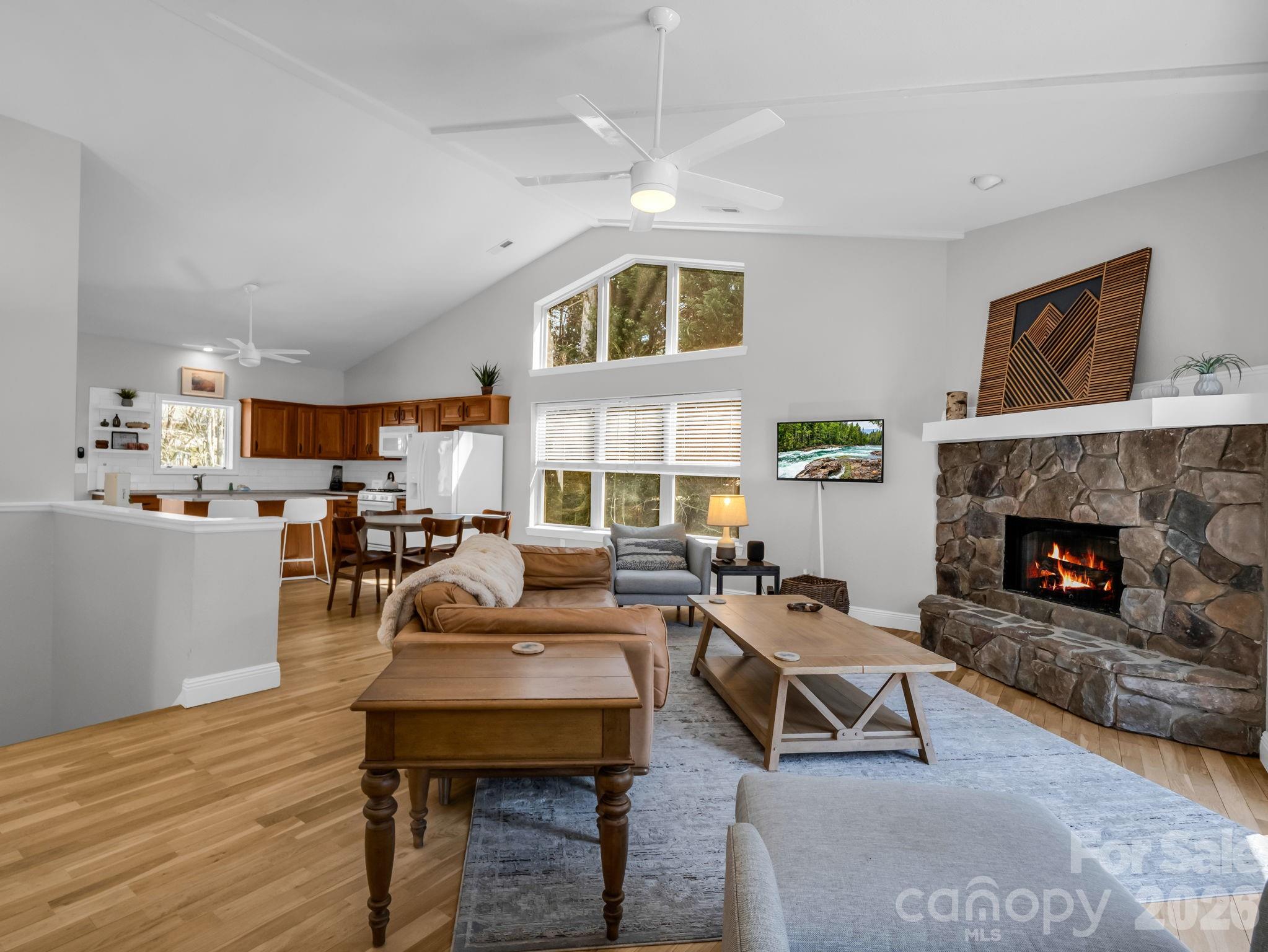 121 Fern Loop Lake Lure, NC 28746 - Photo 21 of 40 a living room with furniture and a fireplace
