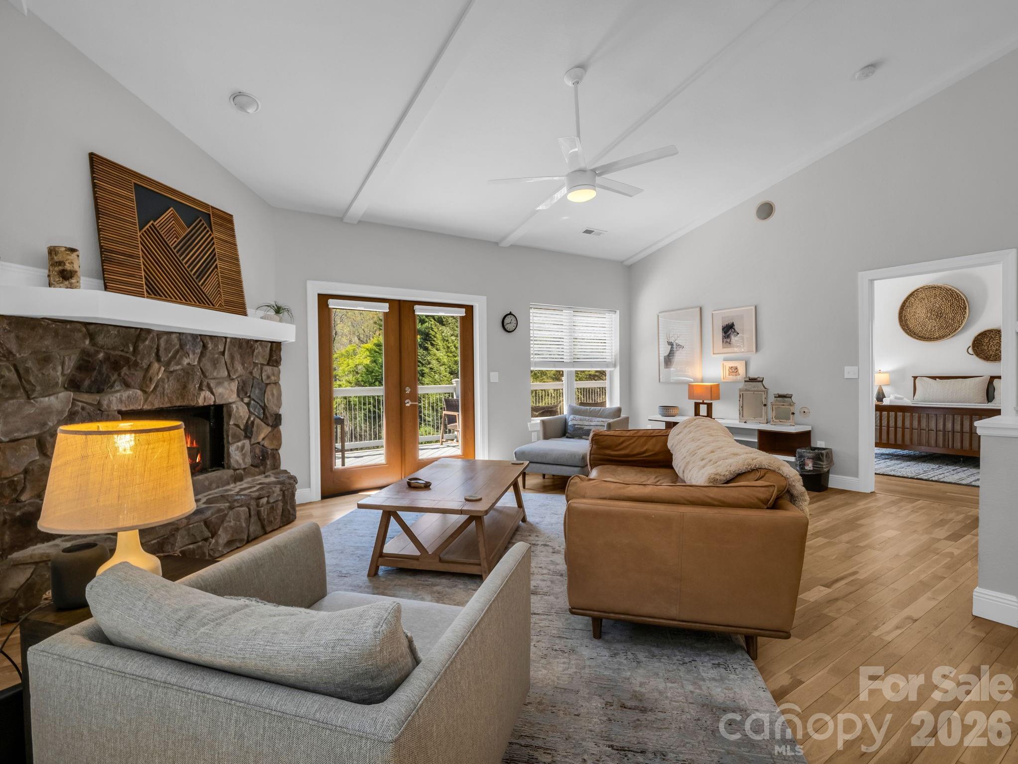 121 Fern Loop Lake Lure, NC 28746 - Photo 22 of 40 a living room with furniture and a fireplace