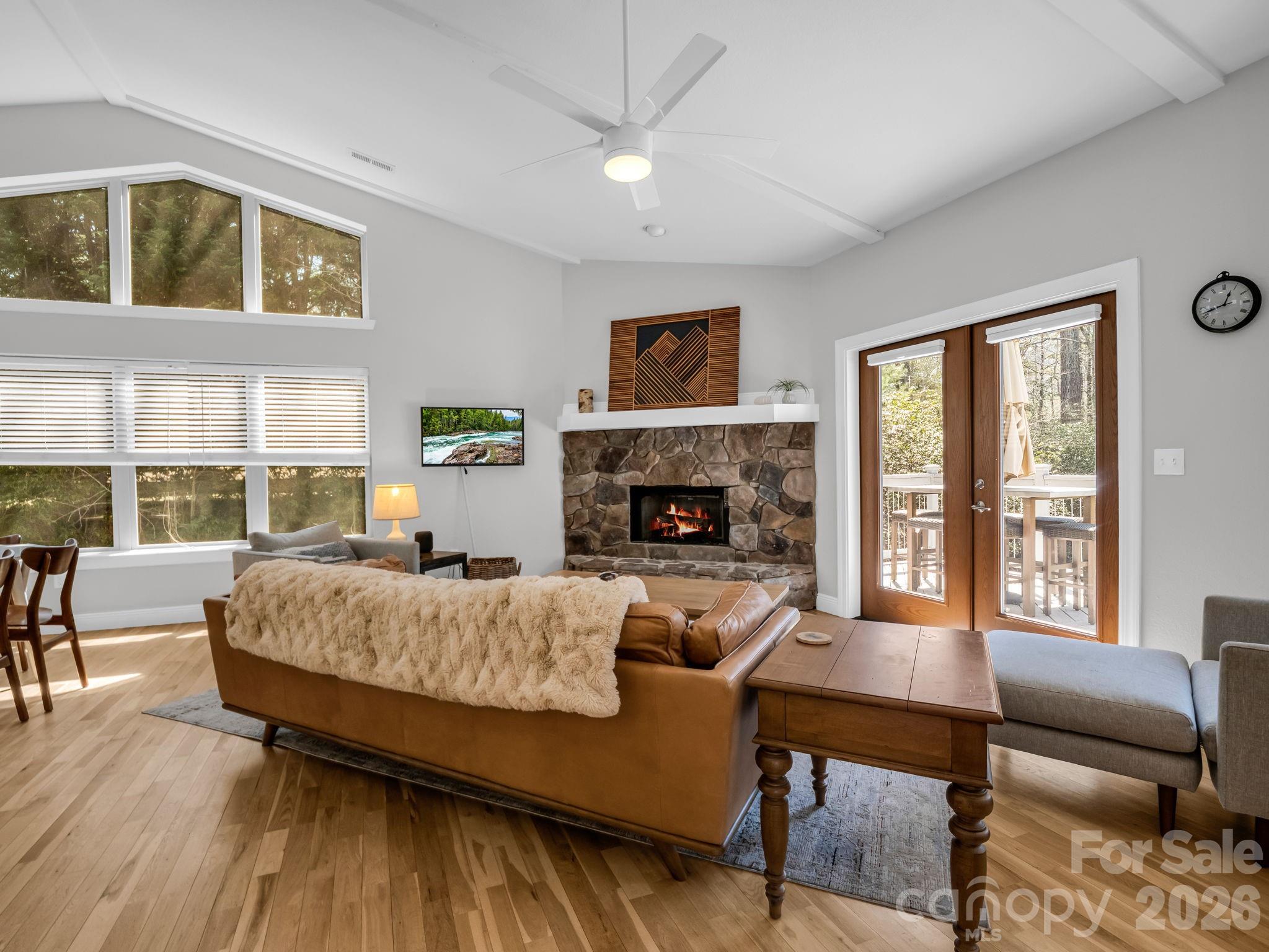 121 Fern Loop Lake Lure, NC 28746 - Photo 23 of 40 a living room with furniture and a fireplace