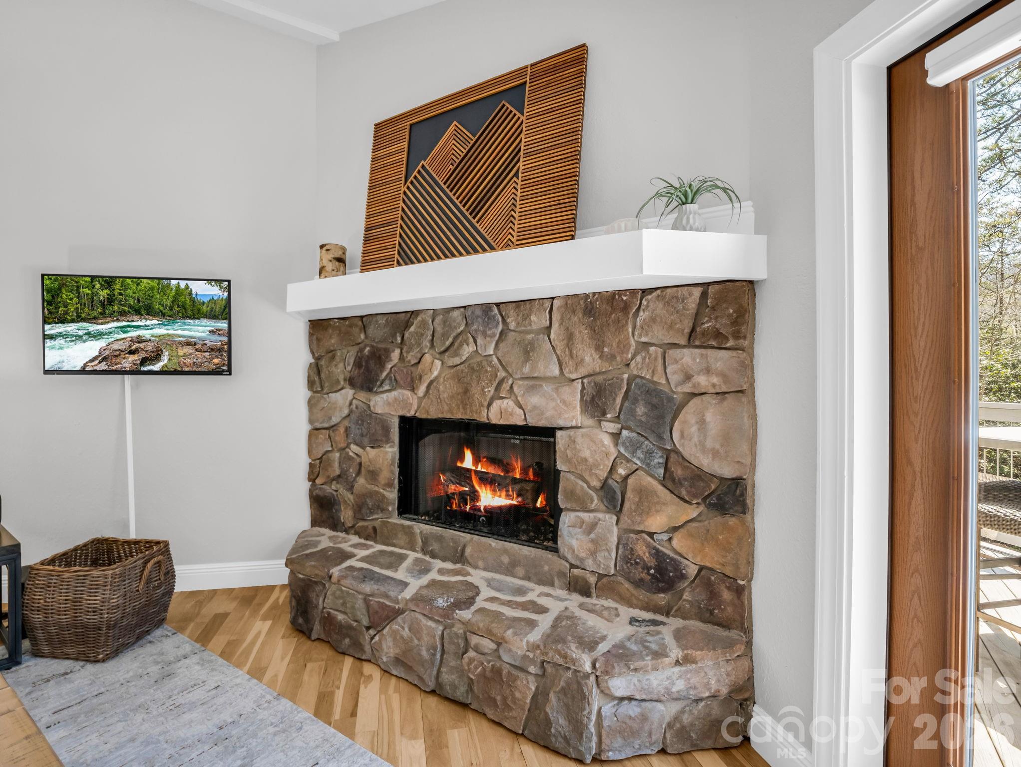 121 Fern Loop Lake Lure, NC 28746 - Photo 24 of 40 a living room with furniture and a fireplace