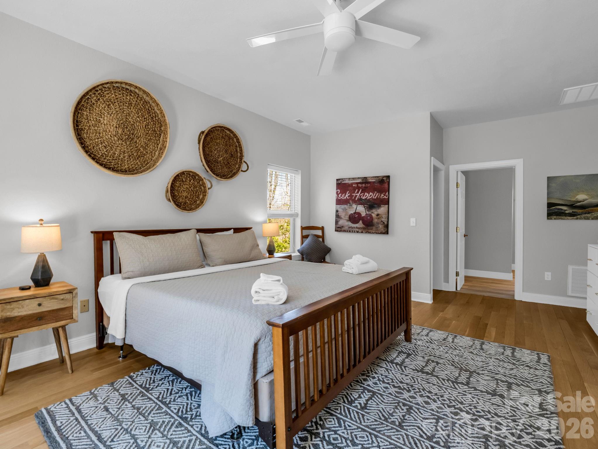 121 Fern Loop Lake Lure, NC 28746 - Photo 31 of 40 a bedroom with bed and a chandelier