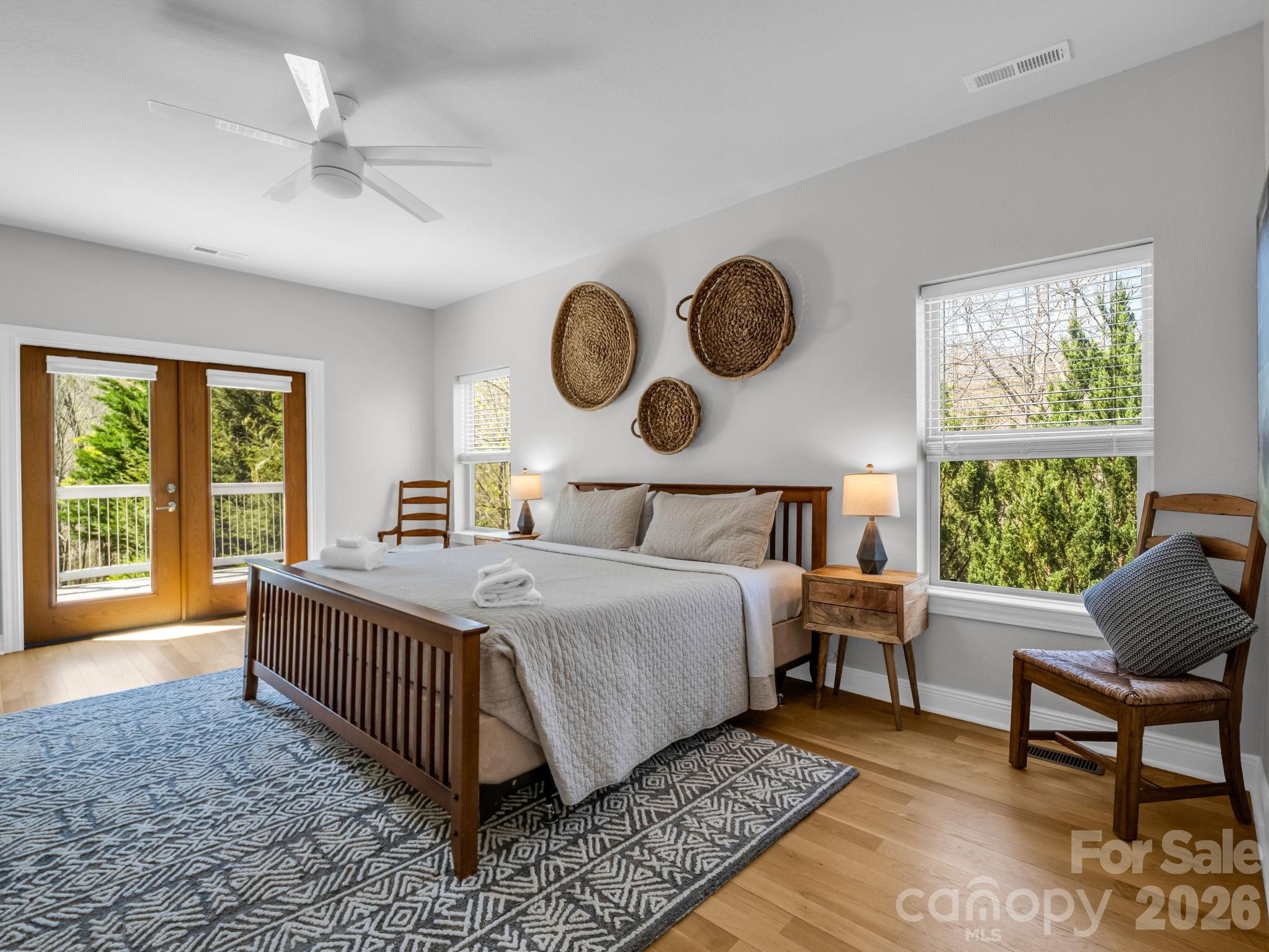 121 Fern Loop Lake Lure, NC 28746 - Photo 32 of 40 a bedroom with bed and a large window