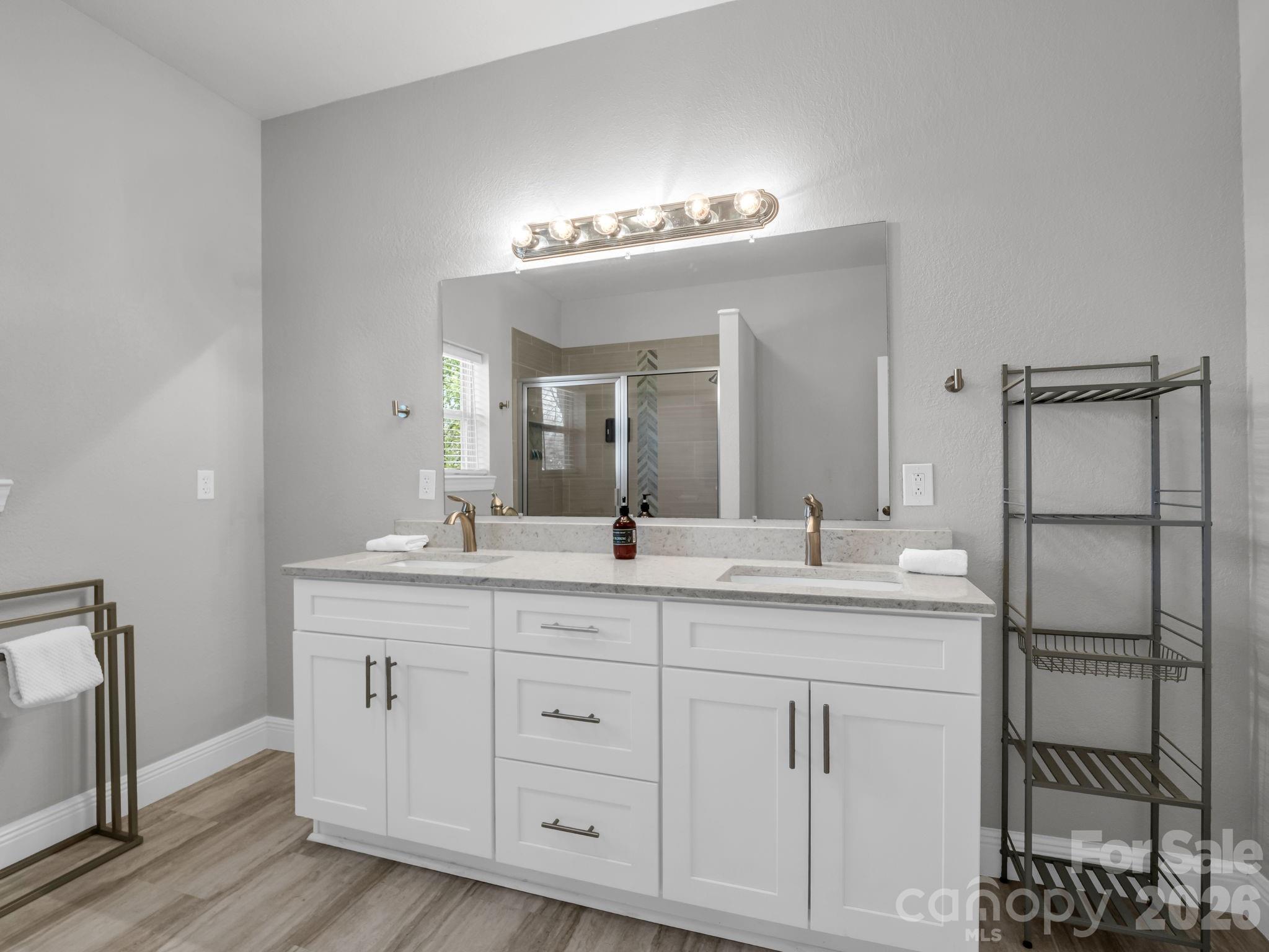 121 Fern Loop Lake Lure, NC 28746 - Photo 34 of 40 a bathroom with a double vanity sink and a mirror