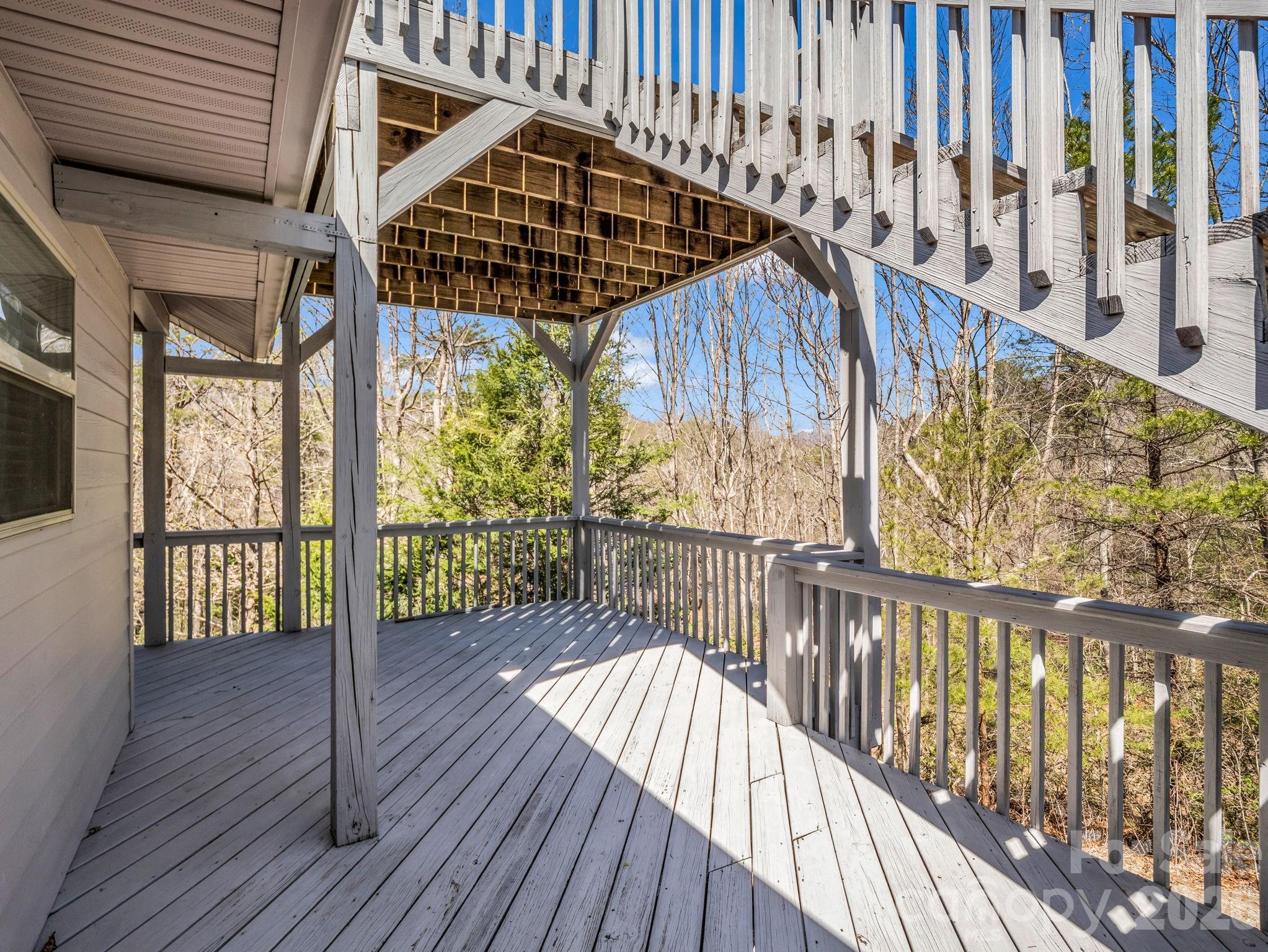 121 Fern Loop Lake Lure, NC 28746 - Photo 37 of 40 a view of balcony with wooden floor