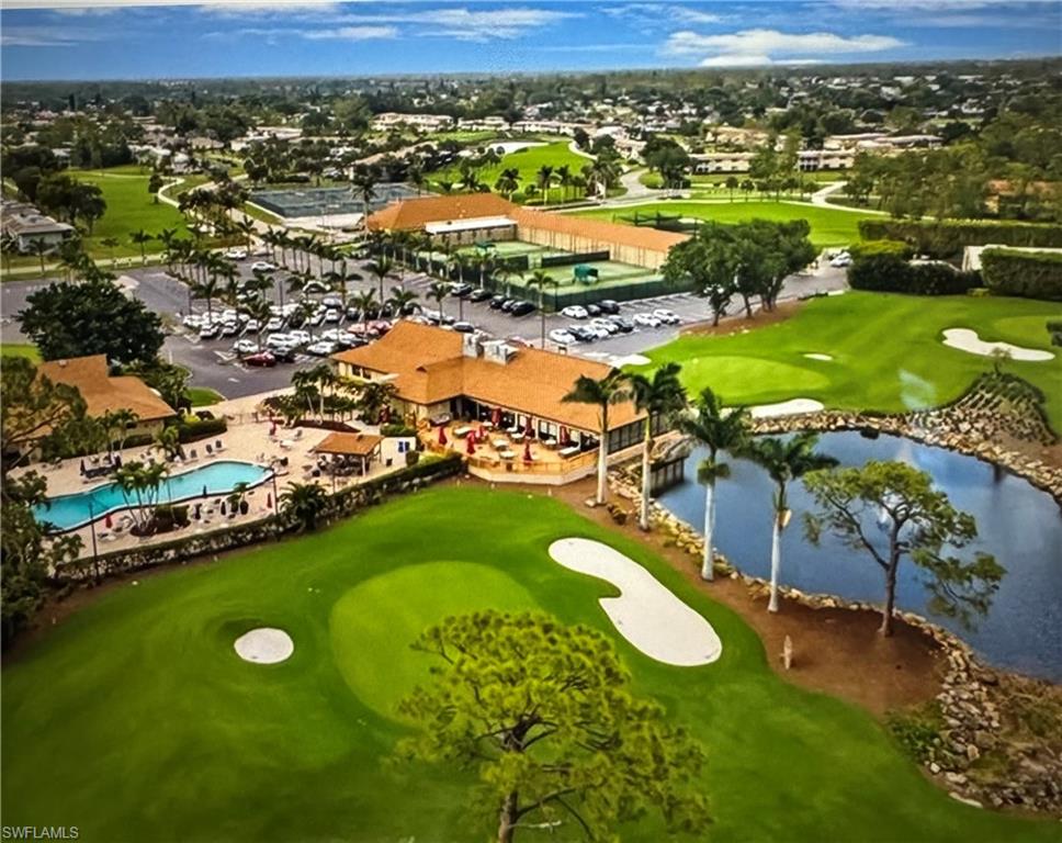 103 Teryl Road, Unit A4 Naples, FL 34112 - Photo 4 of 10 an aerial view of a residential houses with outdoor space swimming pool