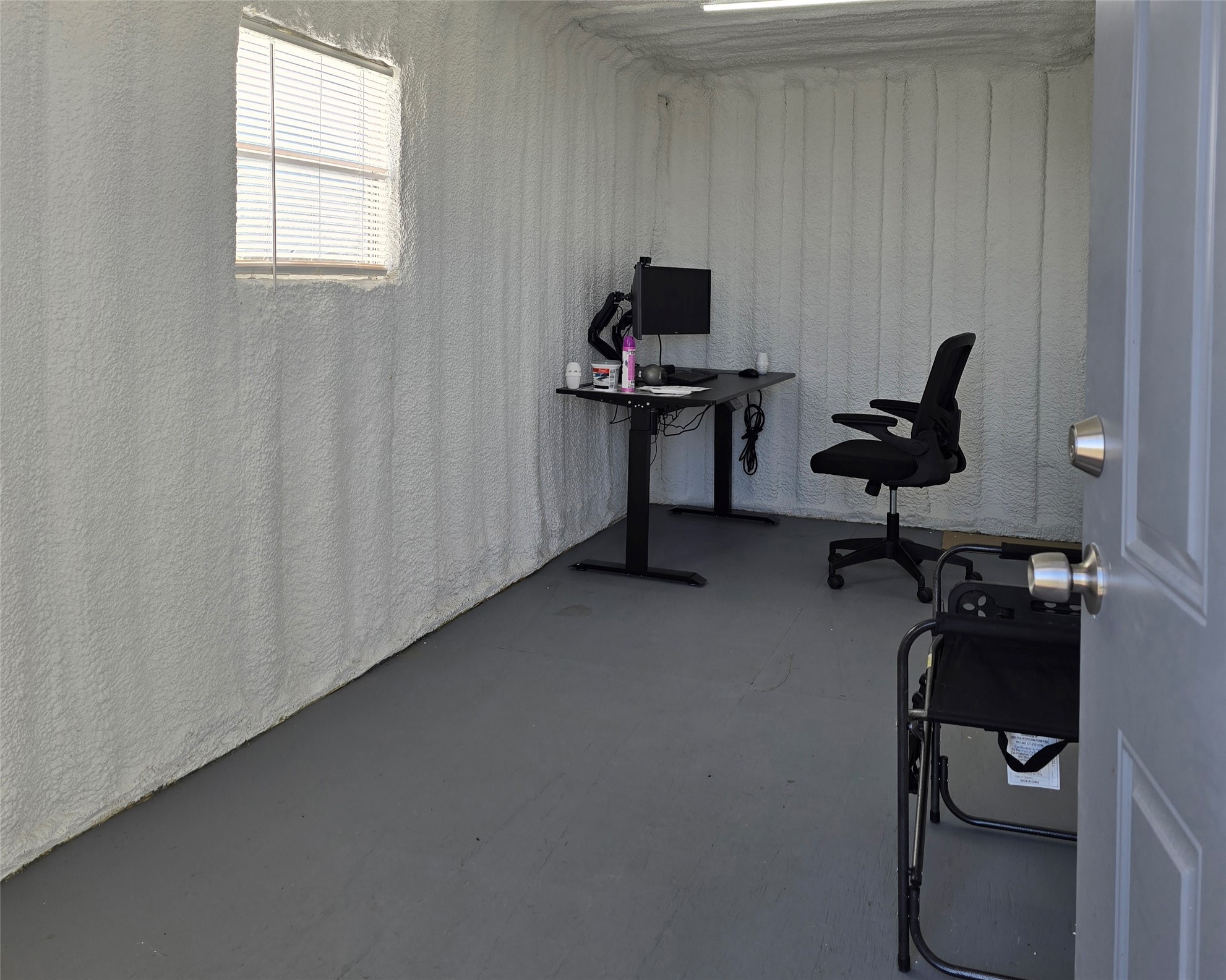 330 Whitmire Road Madisonville, TX 77864 - Photo 6 of 7 a view of a workspace with furniture and a window