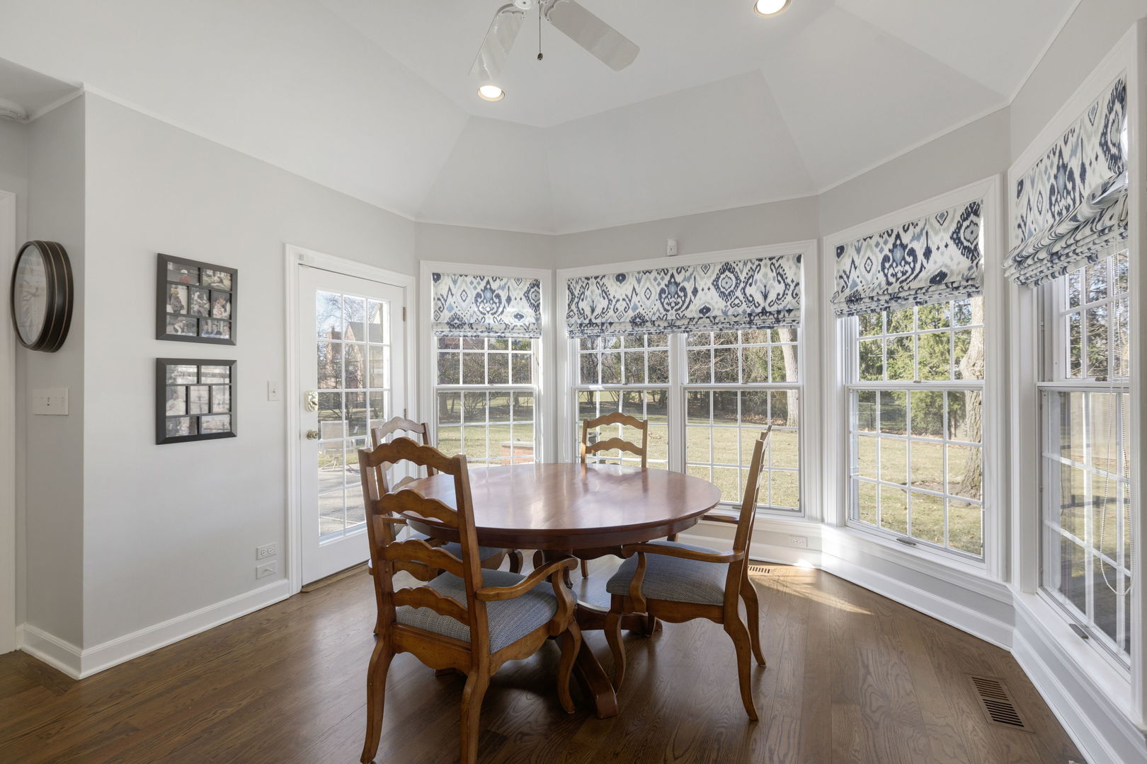 1115 Golfview Lane Glenview, IL 60025 - Photo 15 of 46 a view of a dining room with furniture window and wooden floor