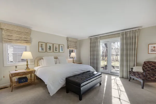 a bedroom with a bed and a couch