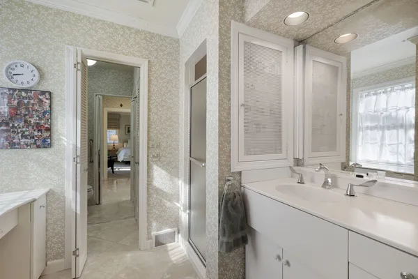a bathroom with a sink and a mirror