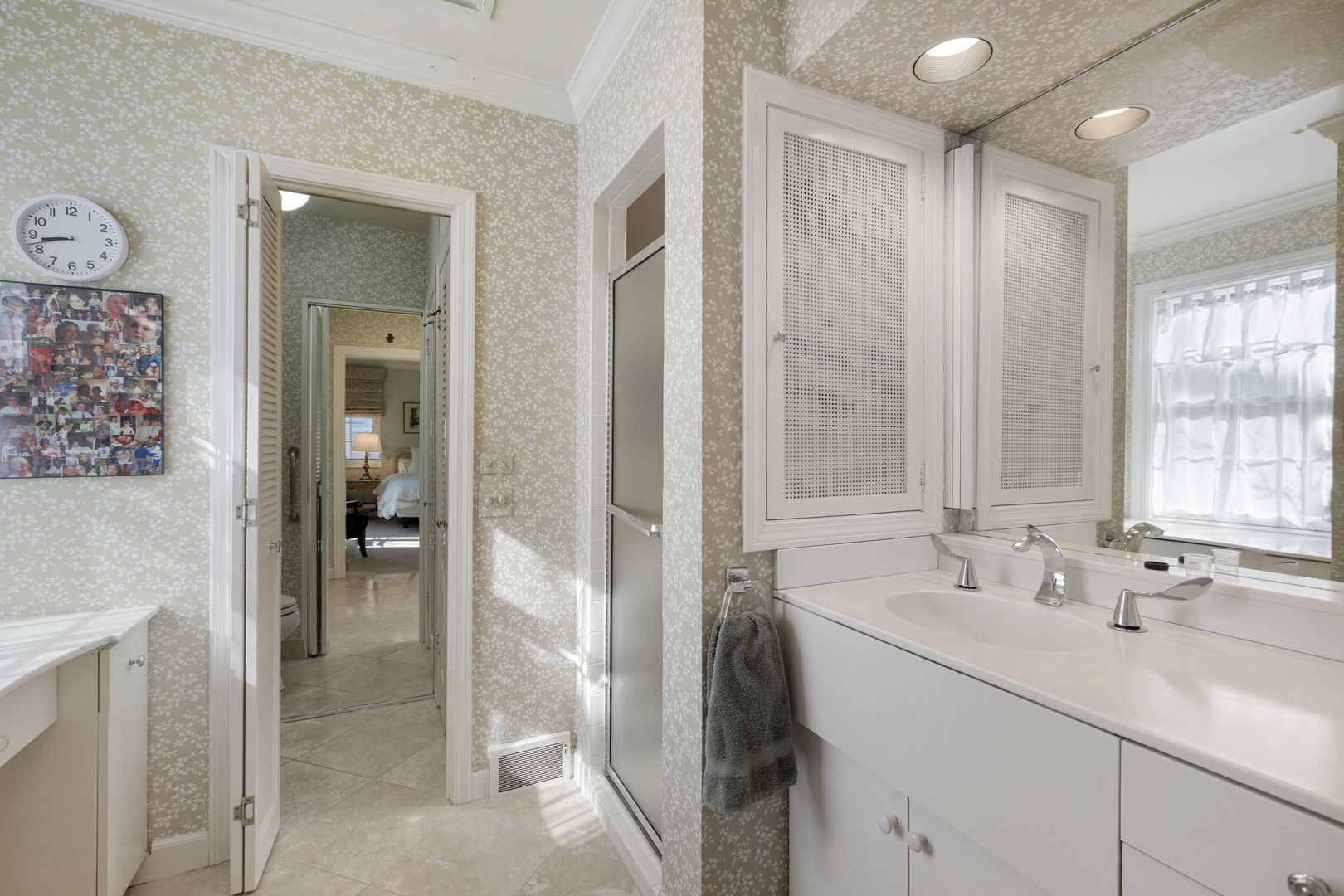 1115 Golfview Lane Glenview, IL 60025 - Photo 26 of 46 a bathroom with a sink and a mirror
