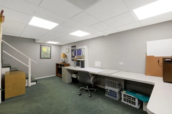 a view of a workspace with furniture