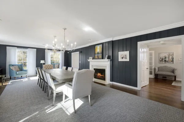 a dining room with furniture a livingroom and chandelier