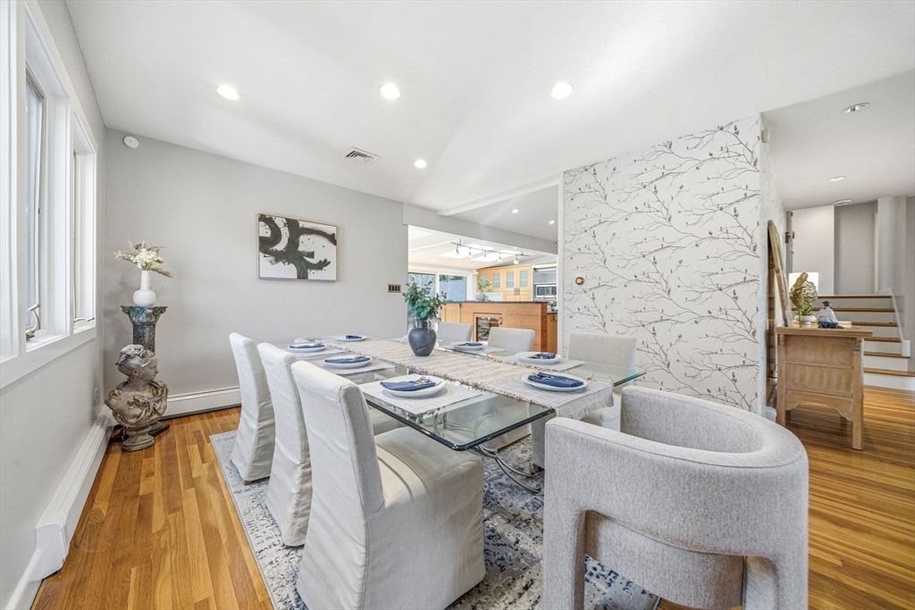 54 Oakvale Road Newton, MA 02468 - Photo 14 of 42 a dining room with furniture and wooden floor