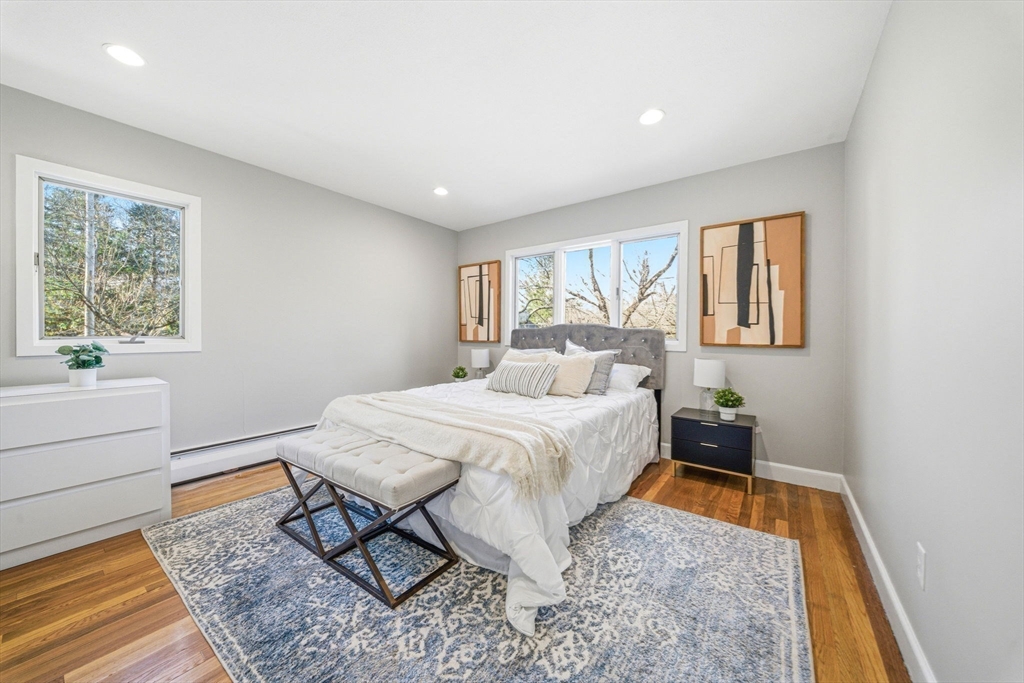 54 Oakvale Road Newton, MA 02468 - Photo 26 of 42 a spacious bedroom with a bed and a window