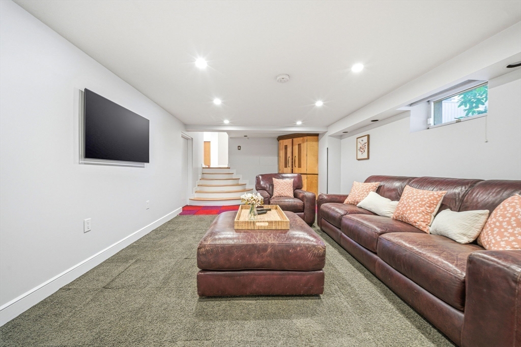 54 Oakvale Road Newton, MA 02468 - Photo 31 of 42 a living room with furniture and a flat screen tv