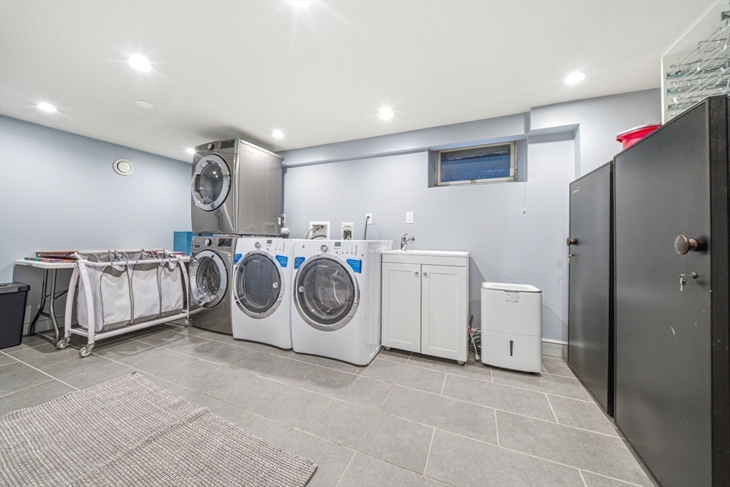 54 Oakvale Road Newton, MA 02468 - Photo 33 of 42 a utility room with dryer and washer