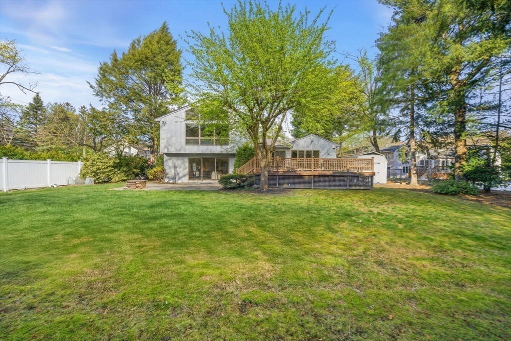 54 Oakvale Road Newton, MA 02468 - Photo 36 of 42 a front view of a house with garden and trees