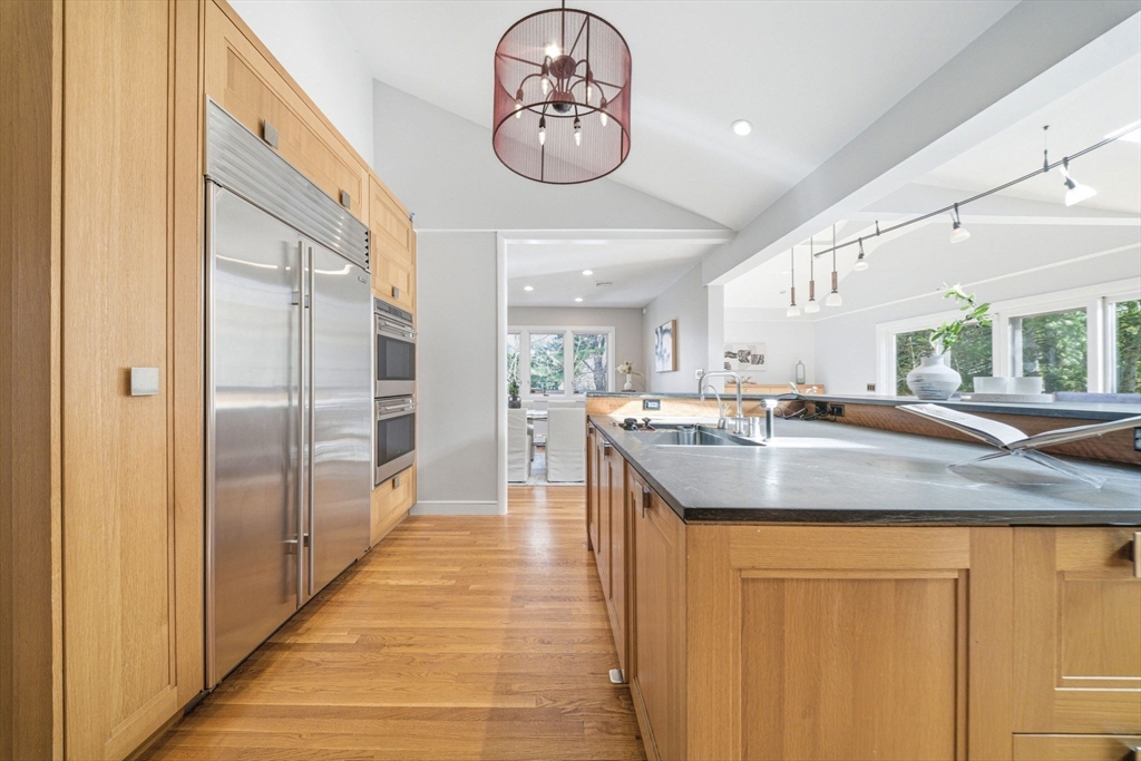 54 Oakvale Road Newton, MA 02468 - Photo 4 of 42 a kitchen with stainless steel appliances granite countertop a sink and a refrigerator