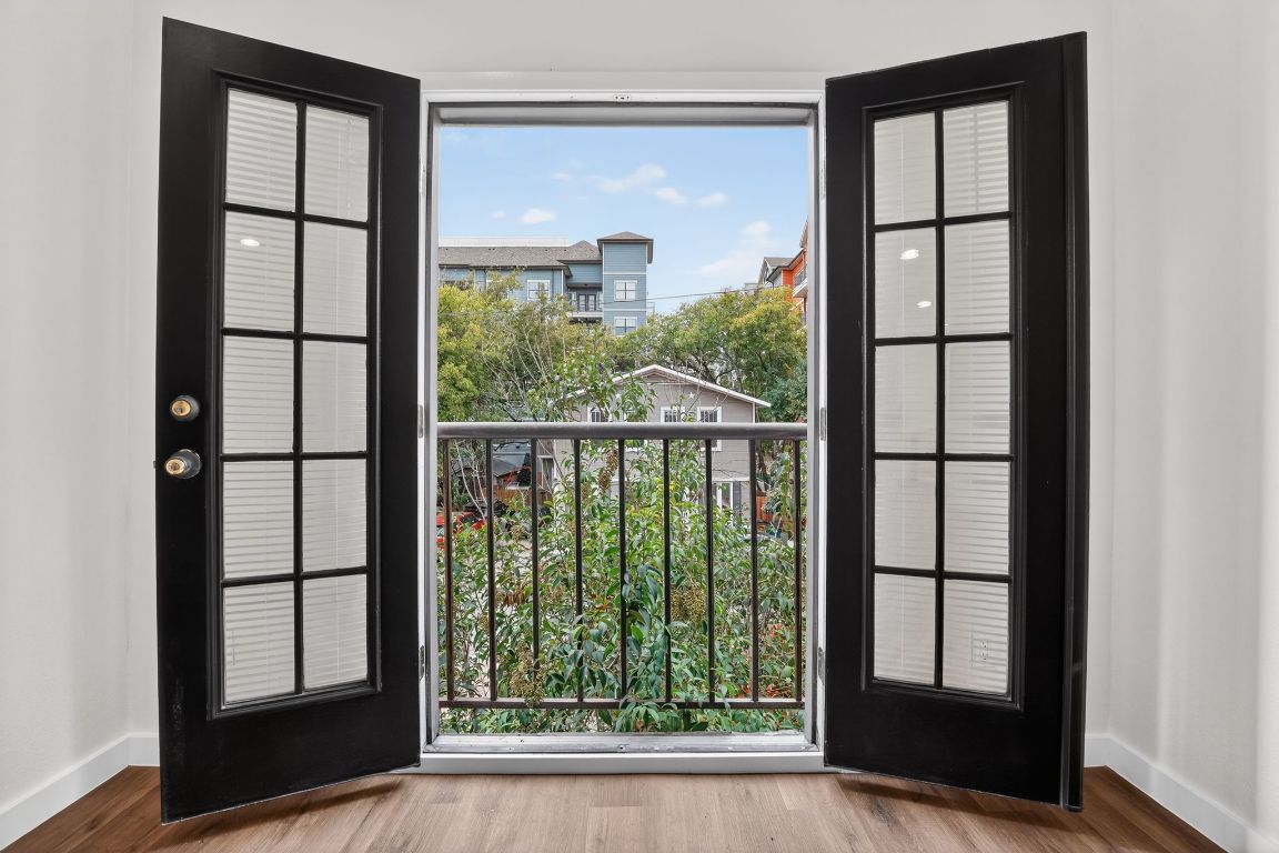 712 Graham Place, Unit 201 Austin, TX 78705 - Photo 15 of 36 a view of porch with a floor to ceiling window