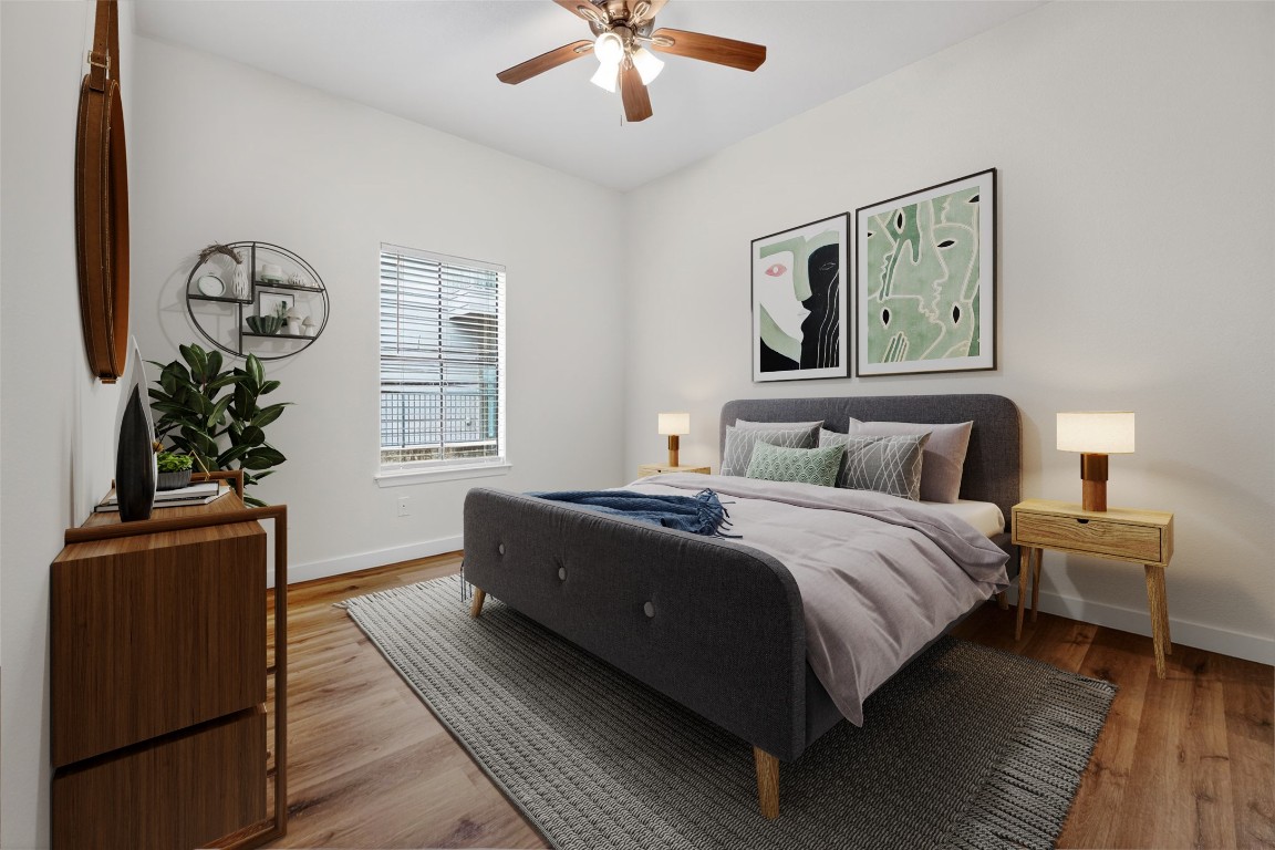 712 Graham Place, Unit 201 Austin, TX 78705 - Photo 3 of 36 a bedroom with a large bed and a window
