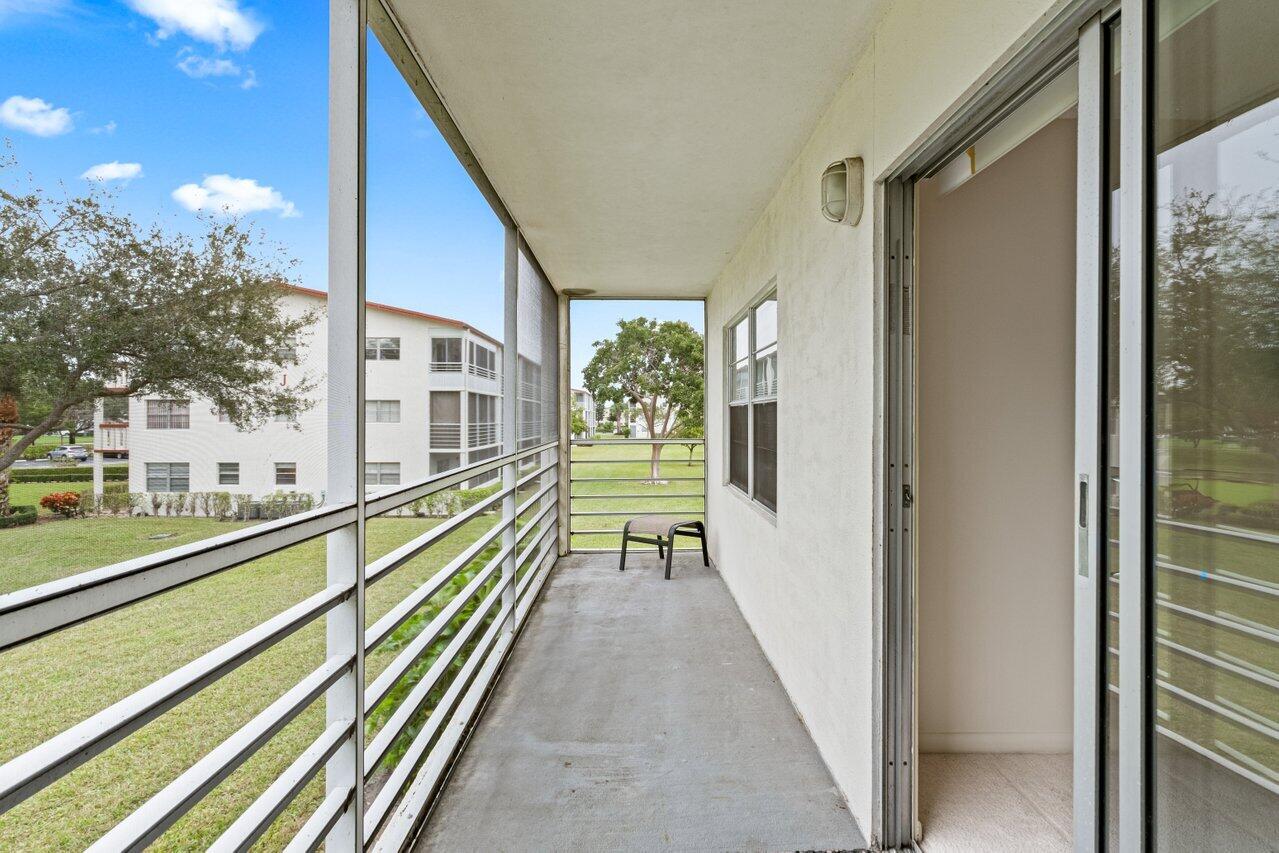 228 Brighton F Boca Raton, FL 33434 - Photo 12 of 24 a view of a balcony with chairs