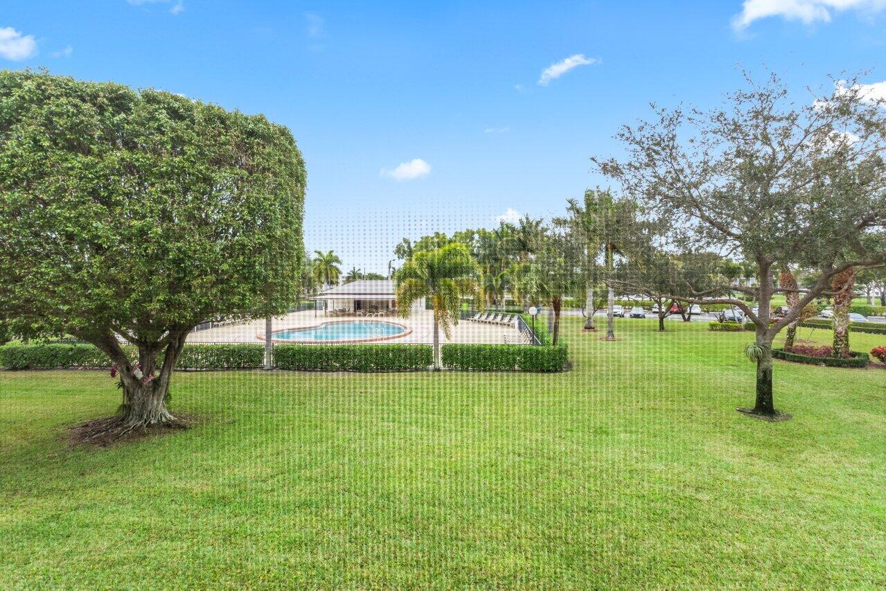 228 Brighton F Boca Raton, FL 33434 - Photo 14 of 24 a view of yard with trees