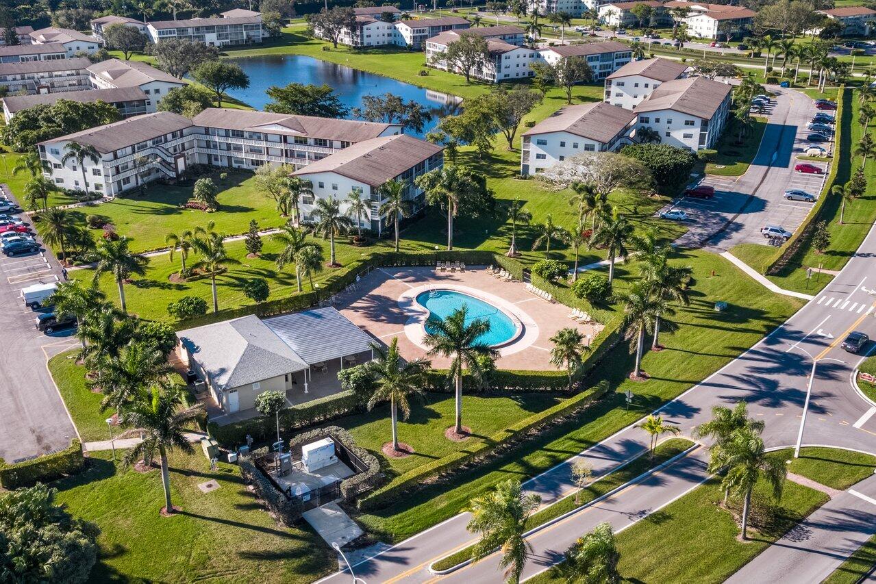 228 Brighton F Boca Raton, FL 33434 - Photo 22 of 24 an aerial view of a swimming pool with outdoor seating