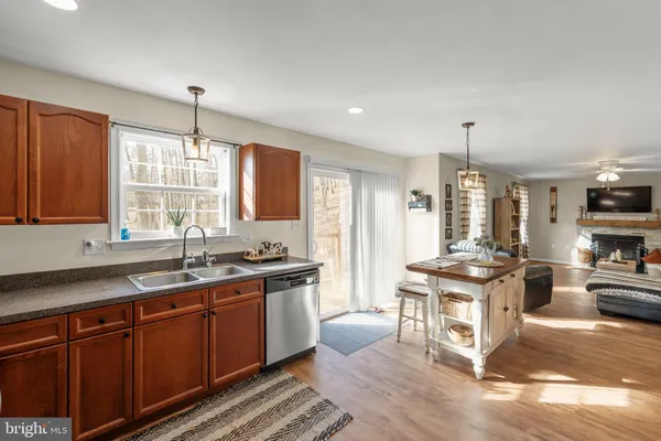 a kitchen with stainless steel appliances a sink stove and refrigerator