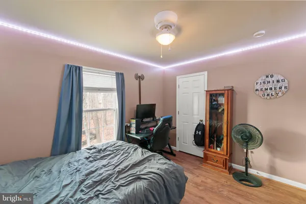a bed room with furniture and a flat screen tv