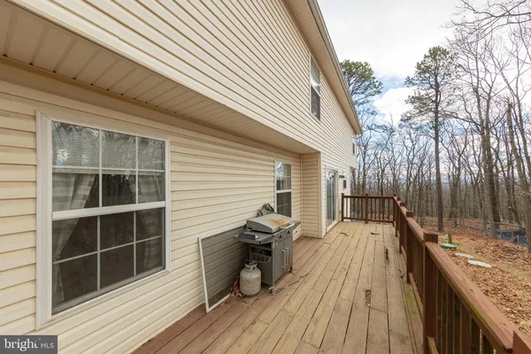 a view of backyard with wooden deck