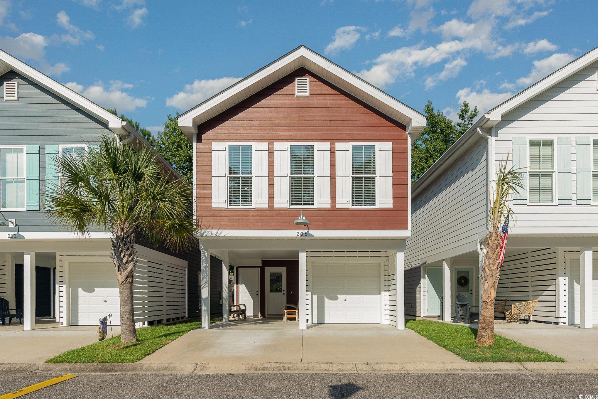 View of front of property with a garage