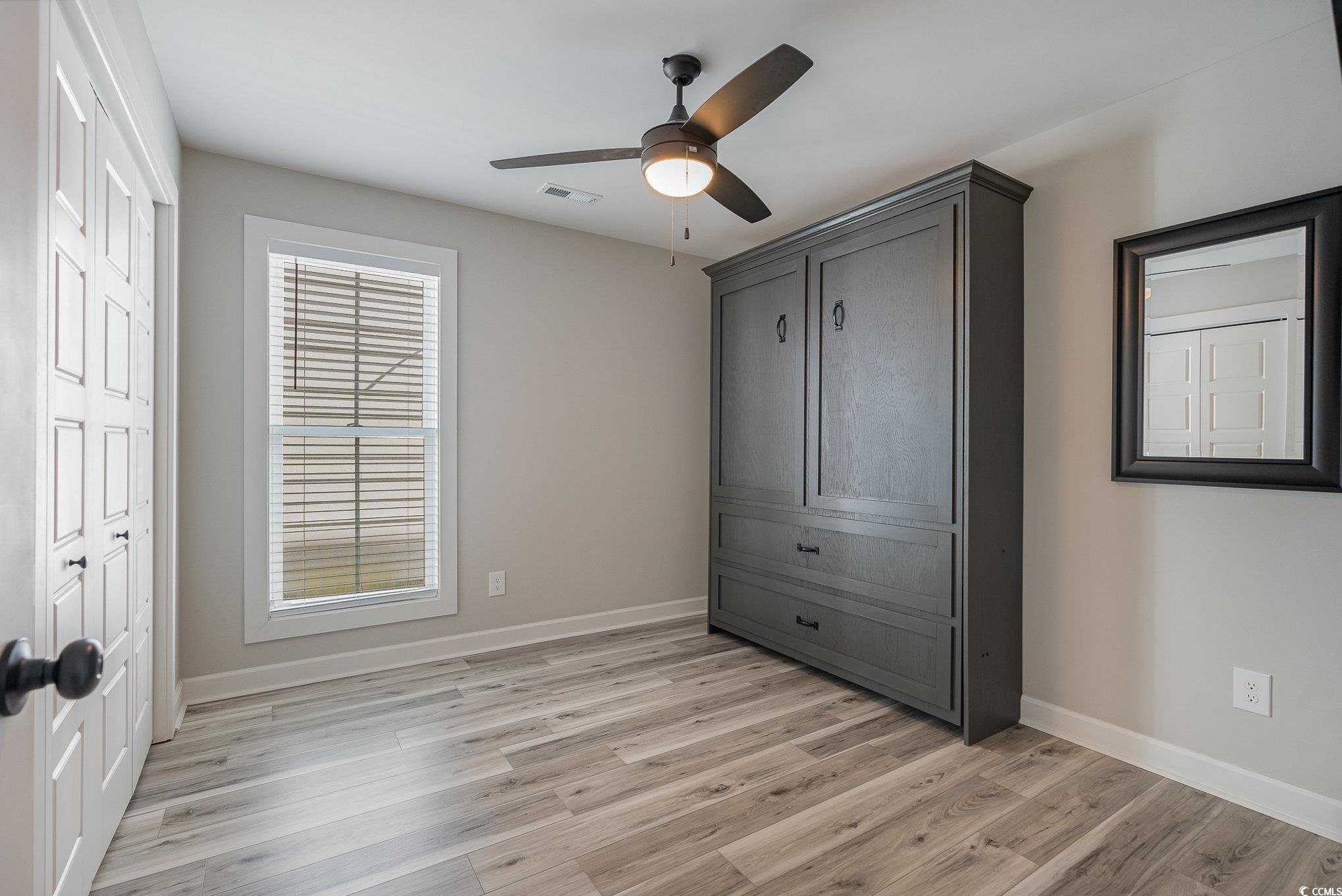 208 Kings Crossing Loop Murrells Inlet, SC 29576 - Photo 17 of 28 Unfurnished bedroom featuring ceiling fan and ligh