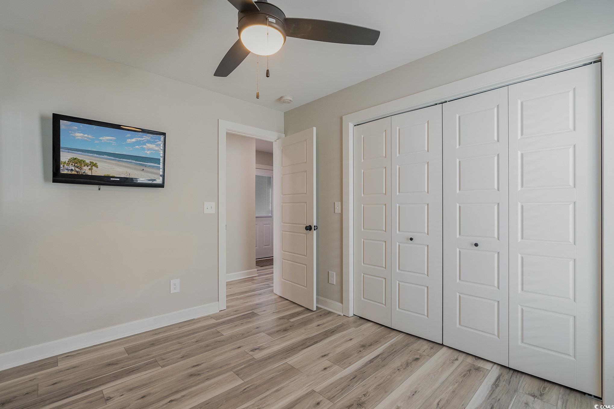 208 Kings Crossing Loop Murrells Inlet, SC 29576 - Photo 18 of 28 Unfurnished bedroom featuring ceiling fan, light h