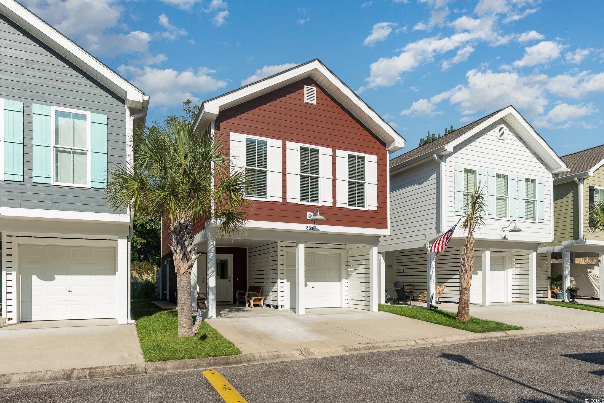 208 Kings Crossing Loop Murrells Inlet, SC 29576 - Photo 2 of 28 Townhome / multi-family property featuring a garag