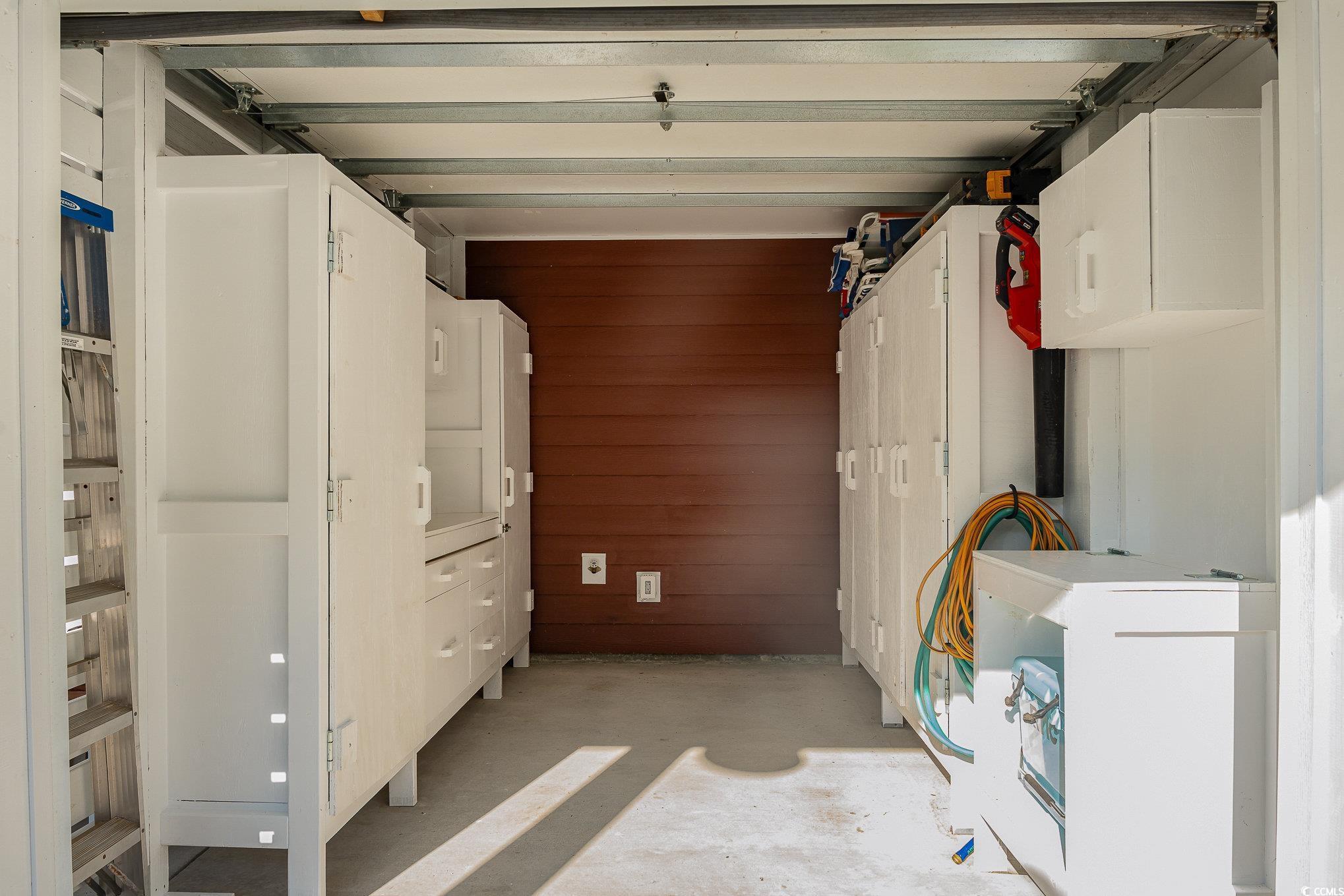 208 Kings Crossing Loop Murrells Inlet, SC 29576 - Photo 25 of 28 Garage with wooden walls