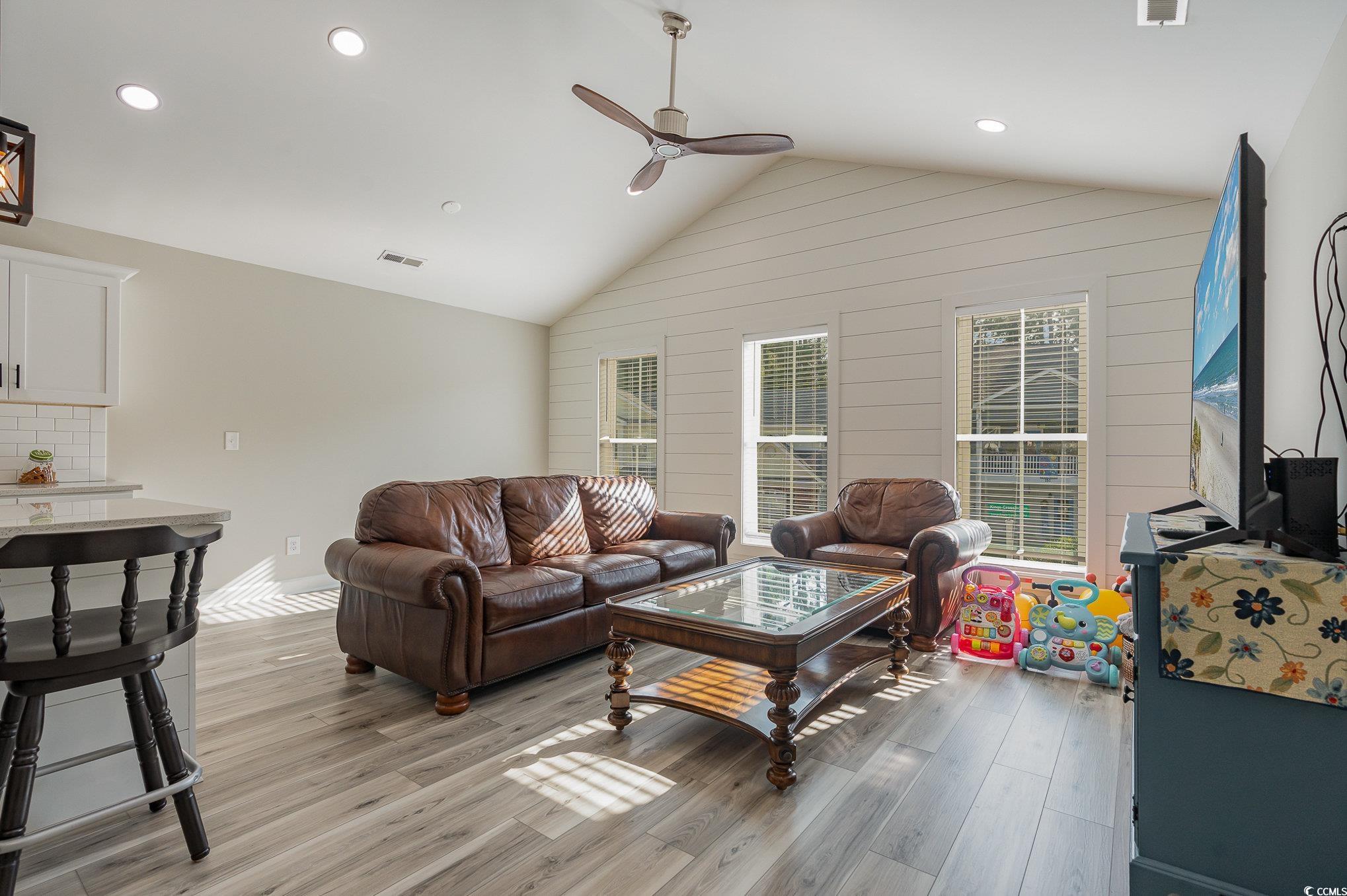 208 Kings Crossing Loop Murrells Inlet, SC 29576 - Photo 5 of 28 Living room with ceiling fan, light hardwood / woo