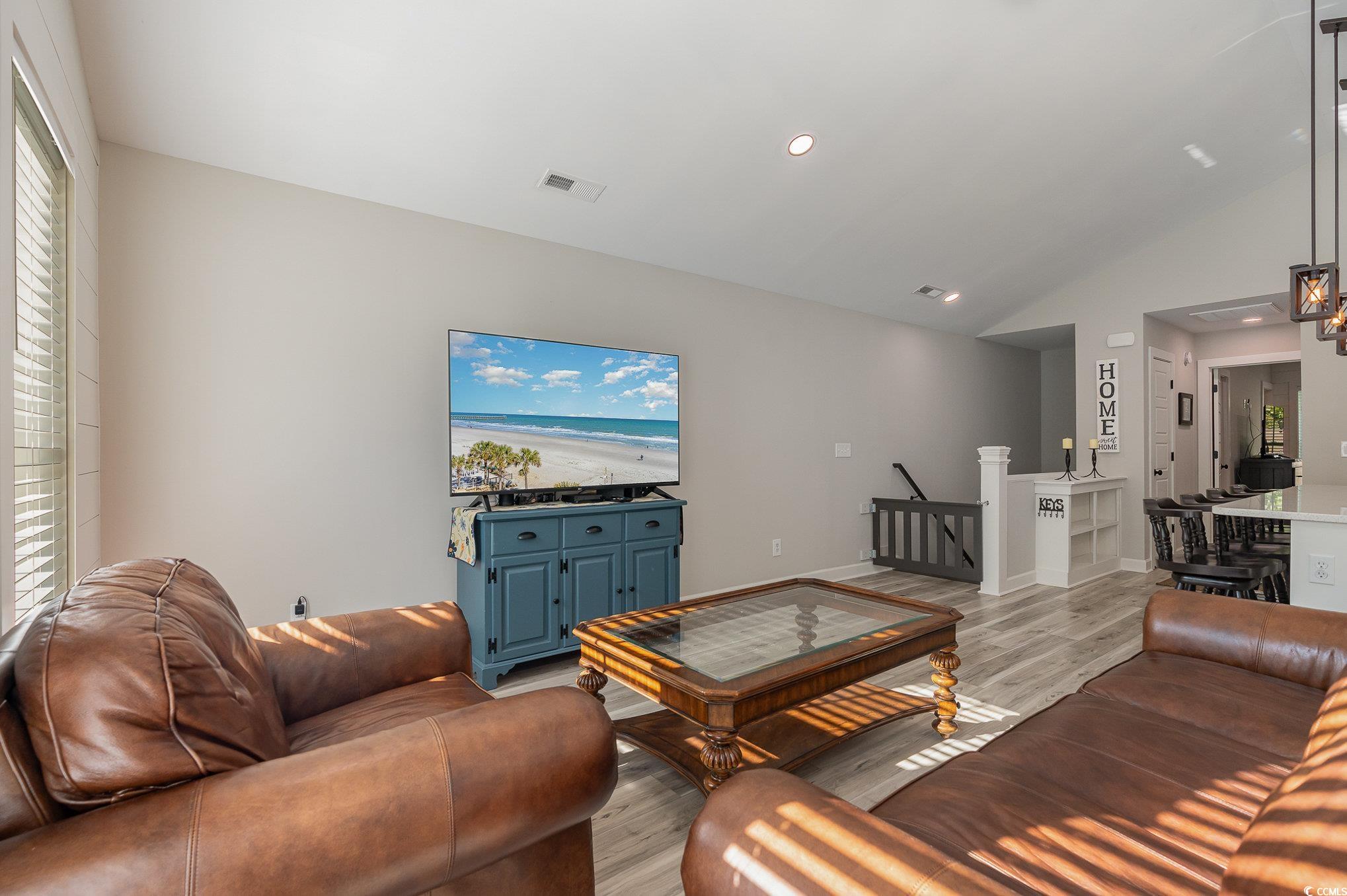 208 Kings Crossing Loop Murrells Inlet, SC 29576 - Photo 6 of 28 Living room with light hardwood / wood-style floor