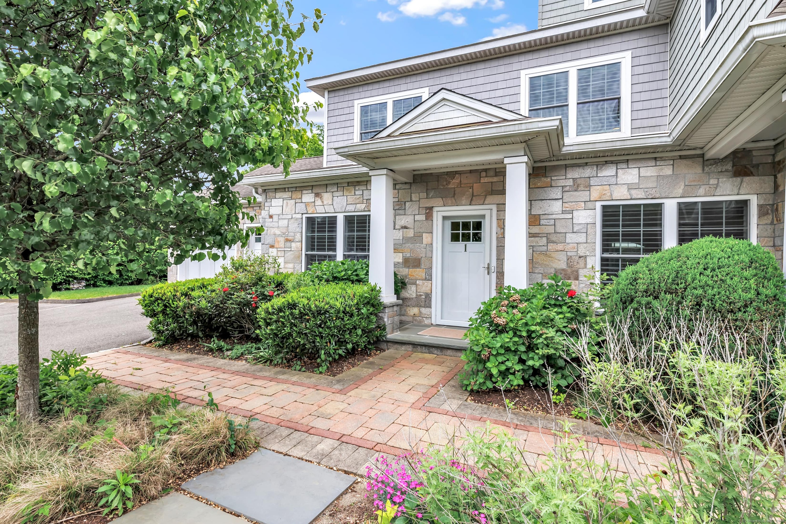 front view of a house with a yard
