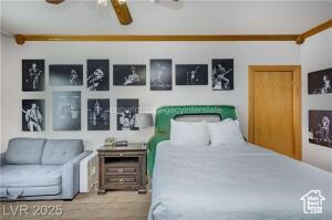 223 Hunter Road, Unit B303 Brian Head, UT 84719 - Photo 7 of 49 Bedroom featuring wood finished floors and a ceiling fan