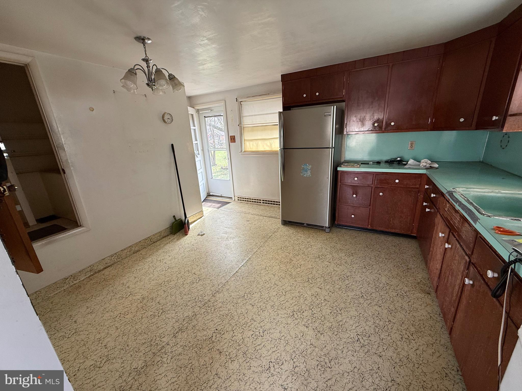 3508 Sheidy Avenue Reading, PA 19605 - Photo 6 of 14 a kitchen with refrigerator a washer and dryer