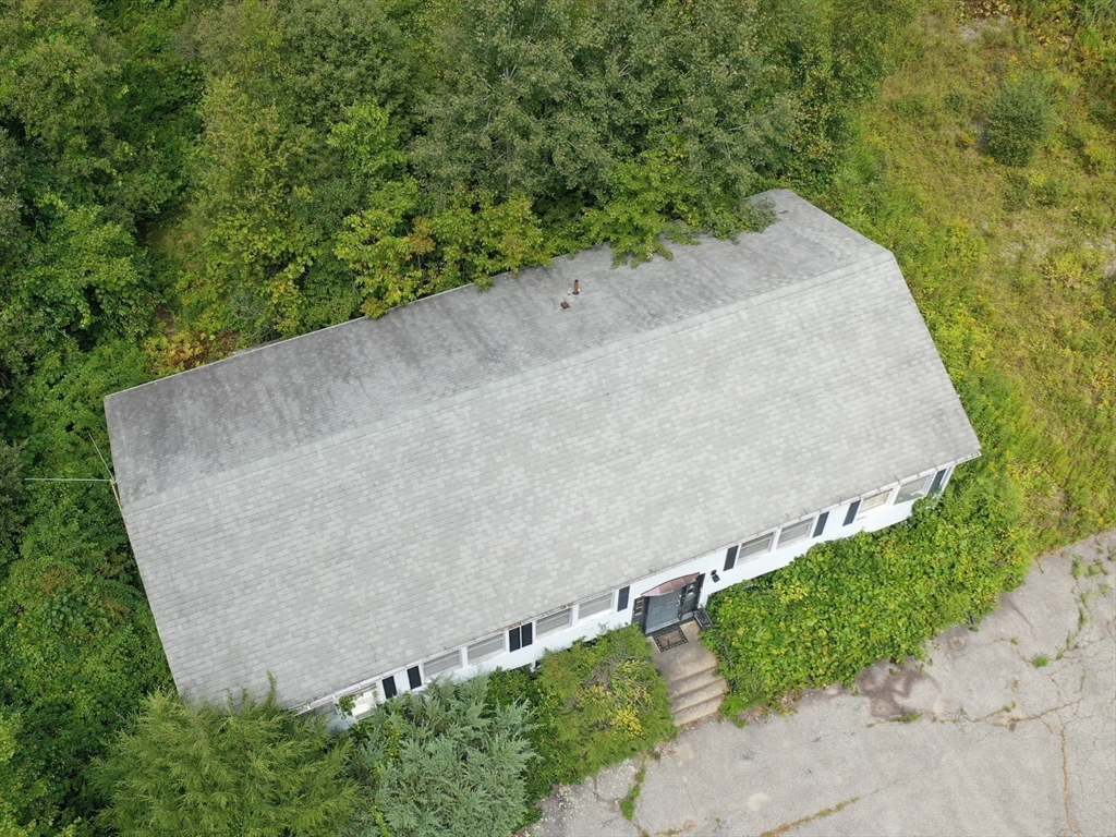 27 Douglas Road Webster, MA 01570 - Photo 5 of 19 an aerial view of a house with a yard and trees