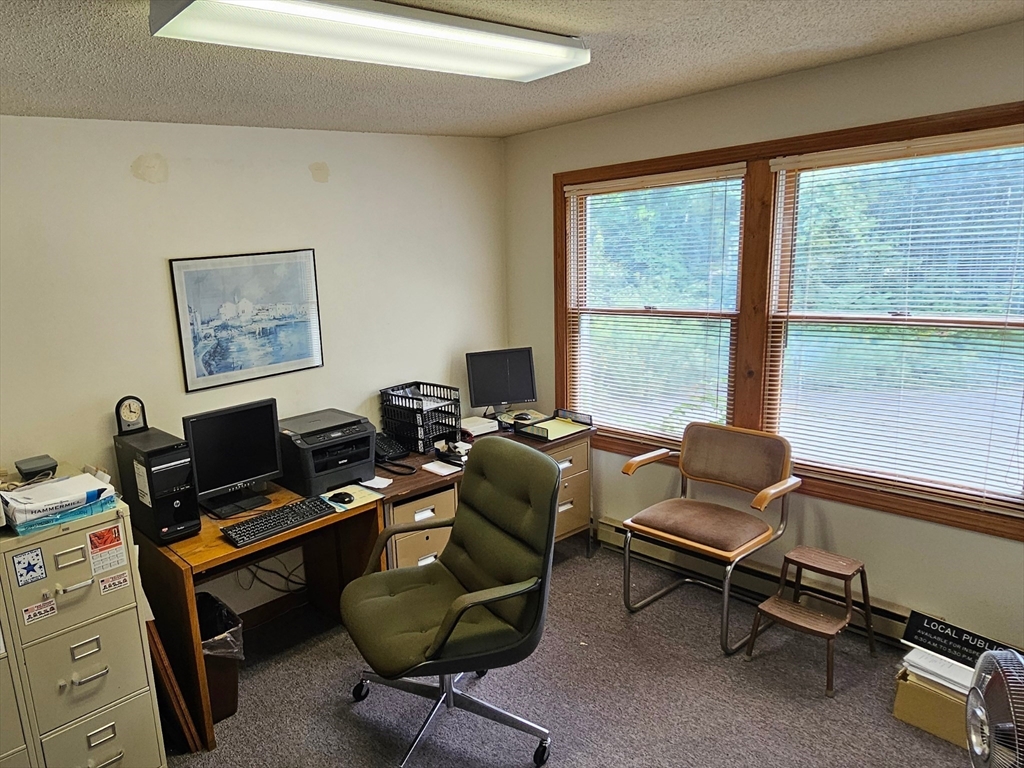 27 Douglas Road Webster, MA 01570 - Photo 8 of 19 a work room with furniture and a window