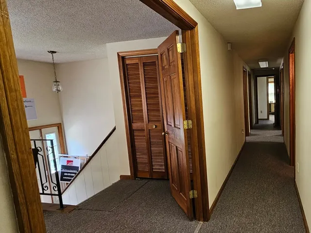 a view of a hallway with staircase