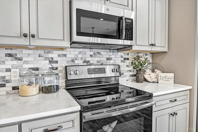 a view of a hallway with a white door and wooden floor